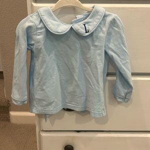 Blue Peter Pan collar shirt with navy “L” monogram